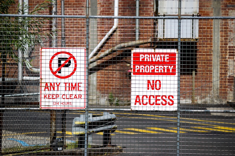 two white-and-red signages