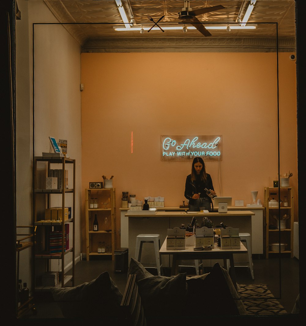 woman standing behind desk