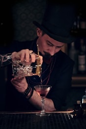 man pouring the wine glass