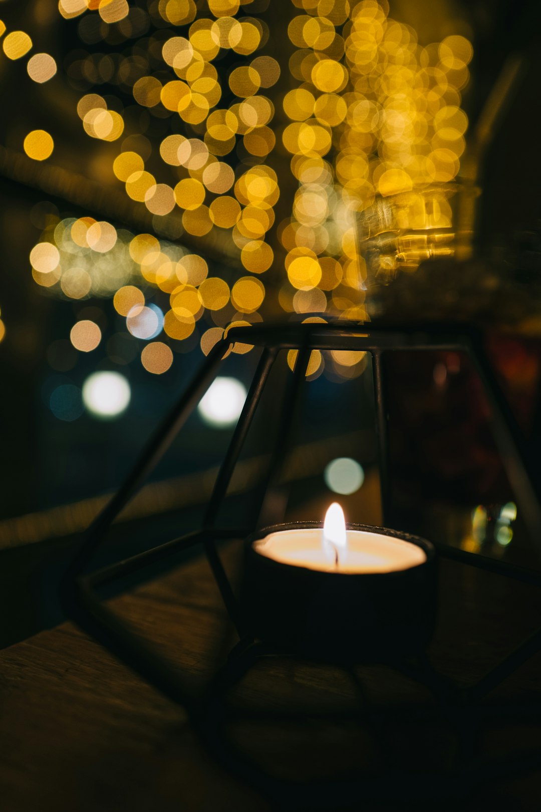 white candle on black candle holder