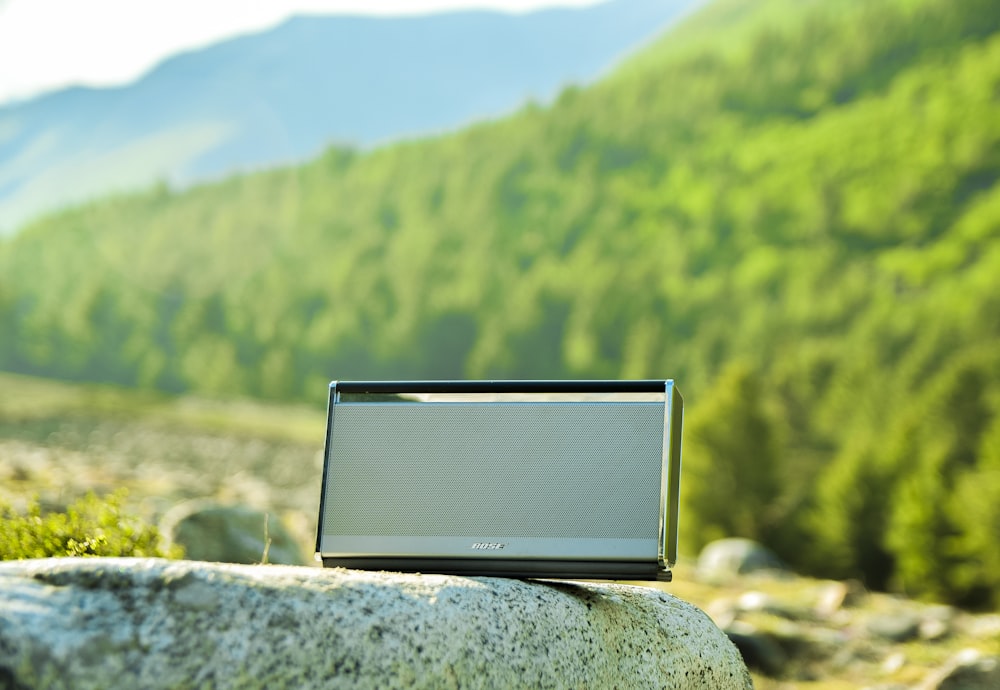 portable speaker on rock