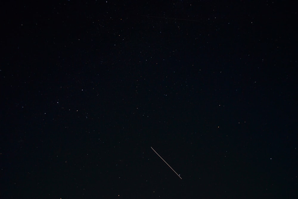 an airplane flying in the sky at night