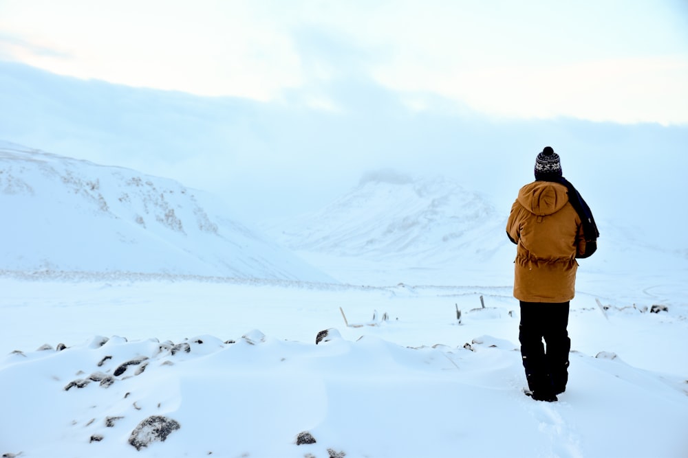 person walking on snow filled area