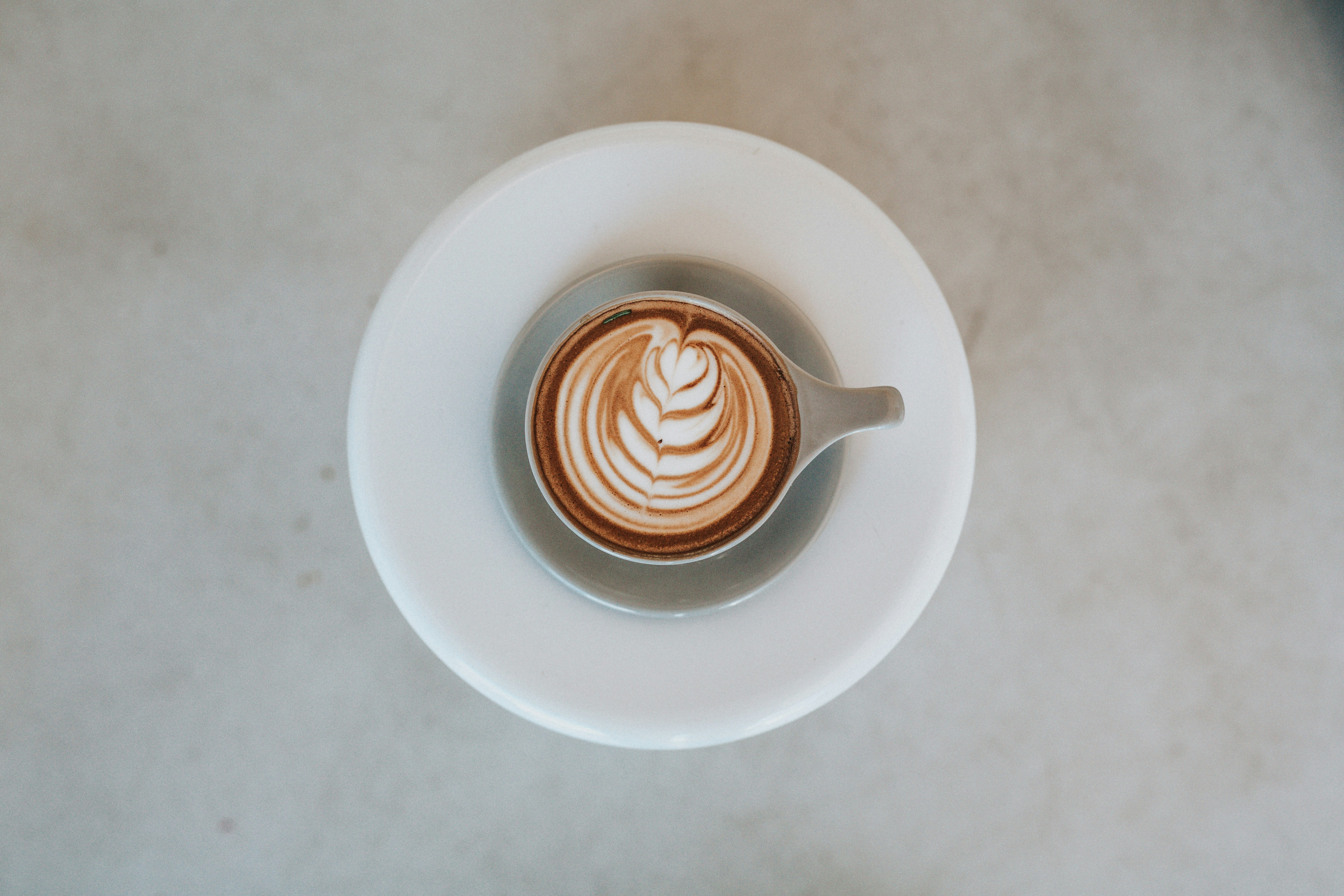 cappuccino in teacup on saucer