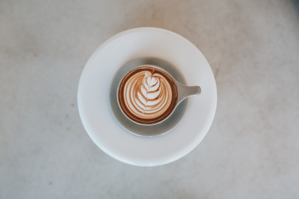 cappuccino in teacup on saucer