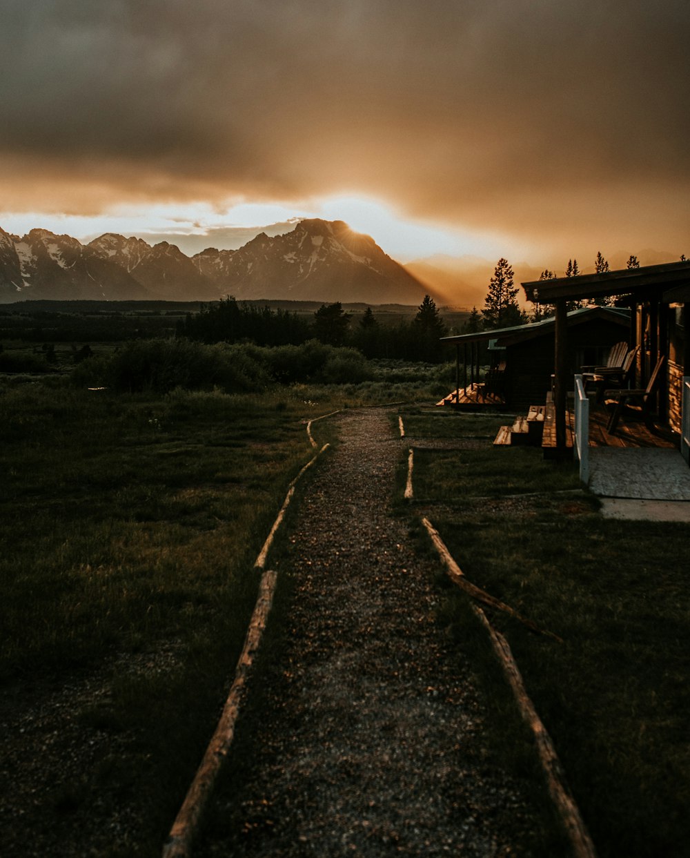 wooden house near mountain during golden hour