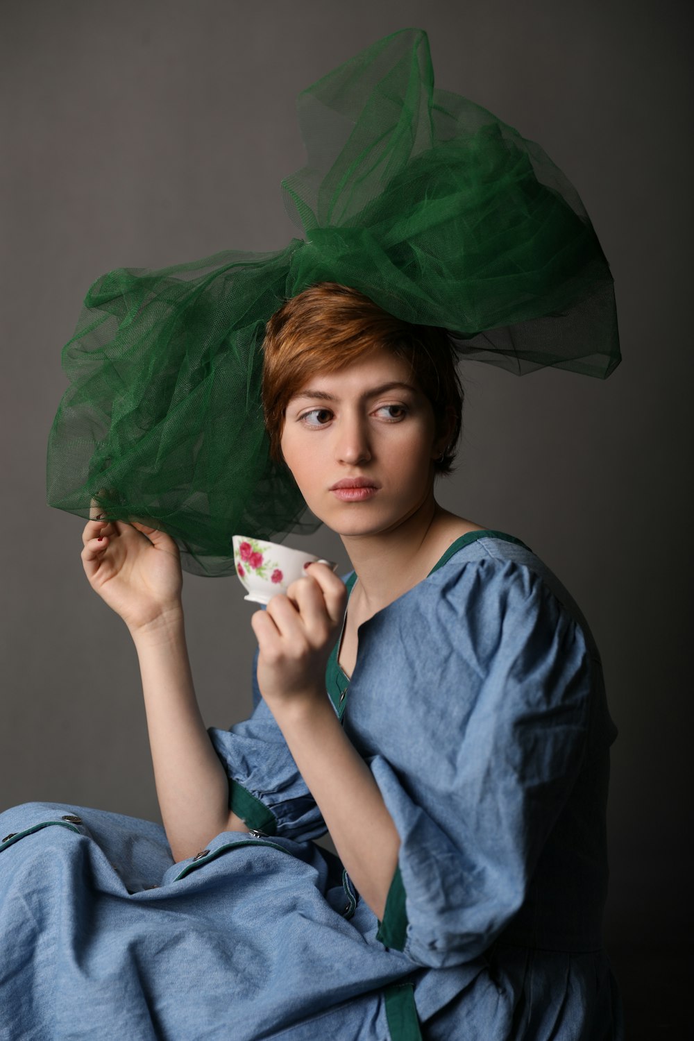 woman holding teacup