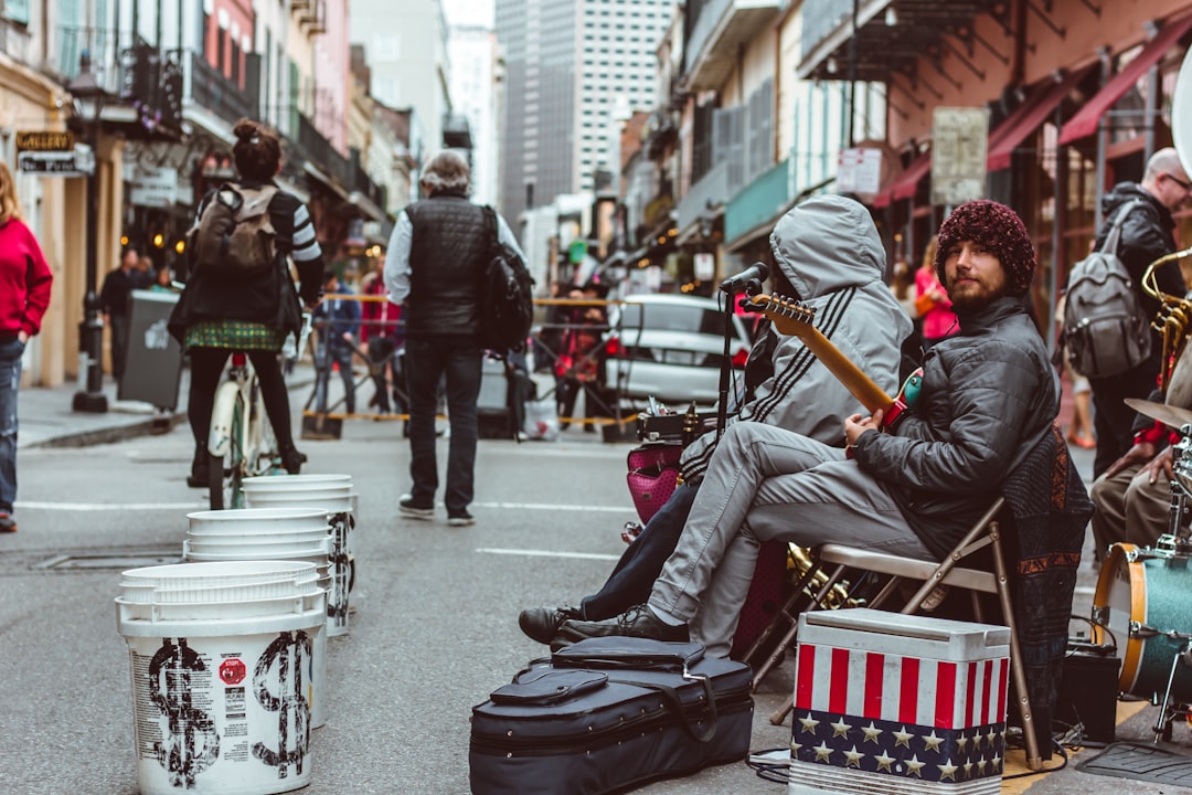 people at the streets near a live band