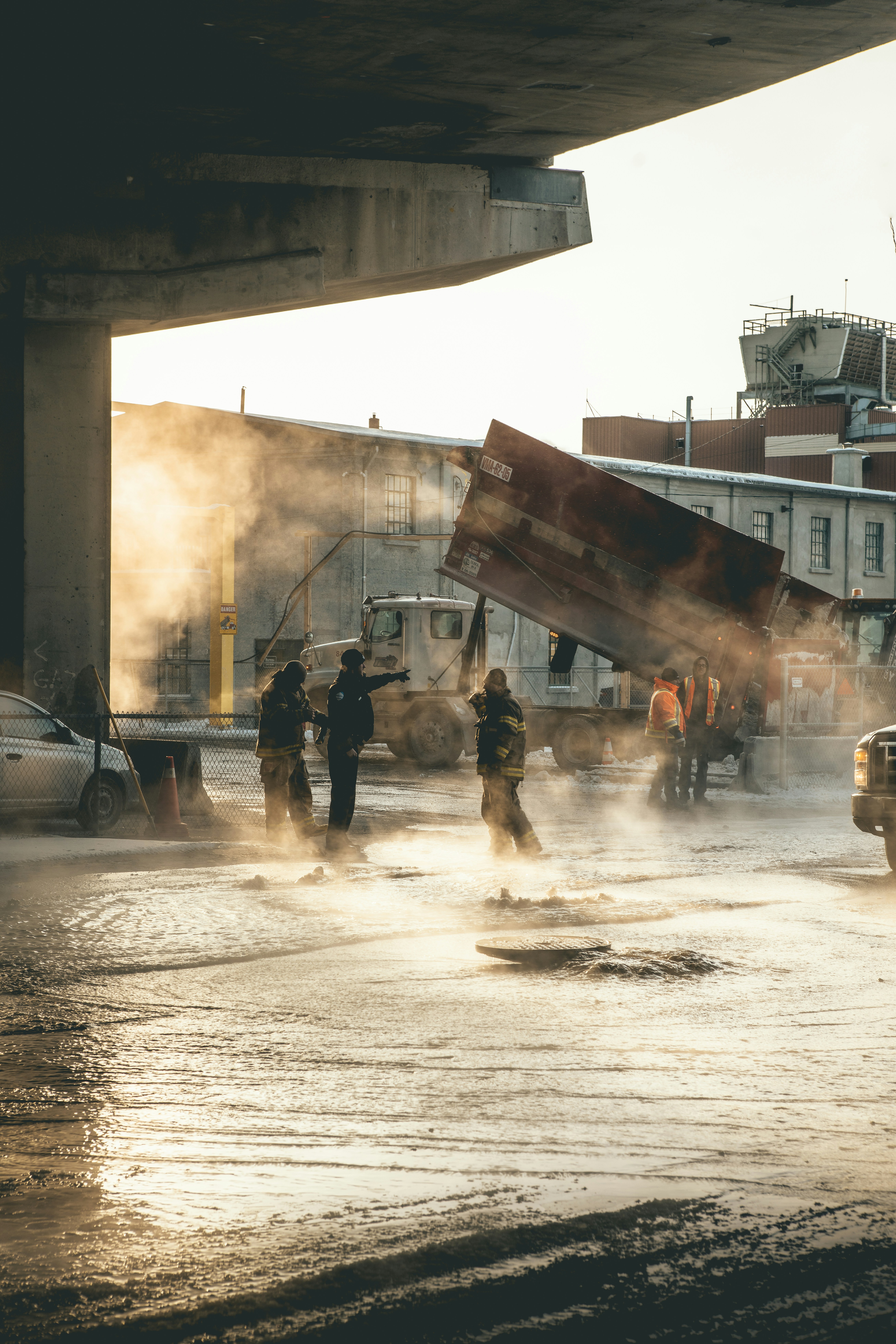 The sewers in Montreal don’t usually fog. But today it was so godamn cold (-31 C) that they were! We passed by this street to catch sunrise by the cityscape and admired the fog. Yet, as we came back, we saw this. There was police, firemen and construction men all over trying to control what seemed like a total overflow. The golden sunrise light made this a perfect seen to capture …