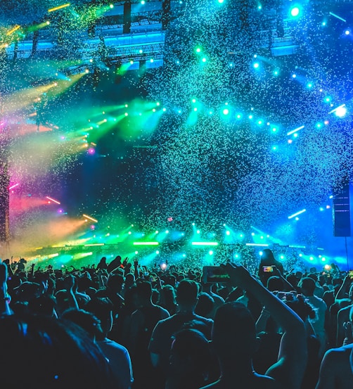 people celebrate in front of stage