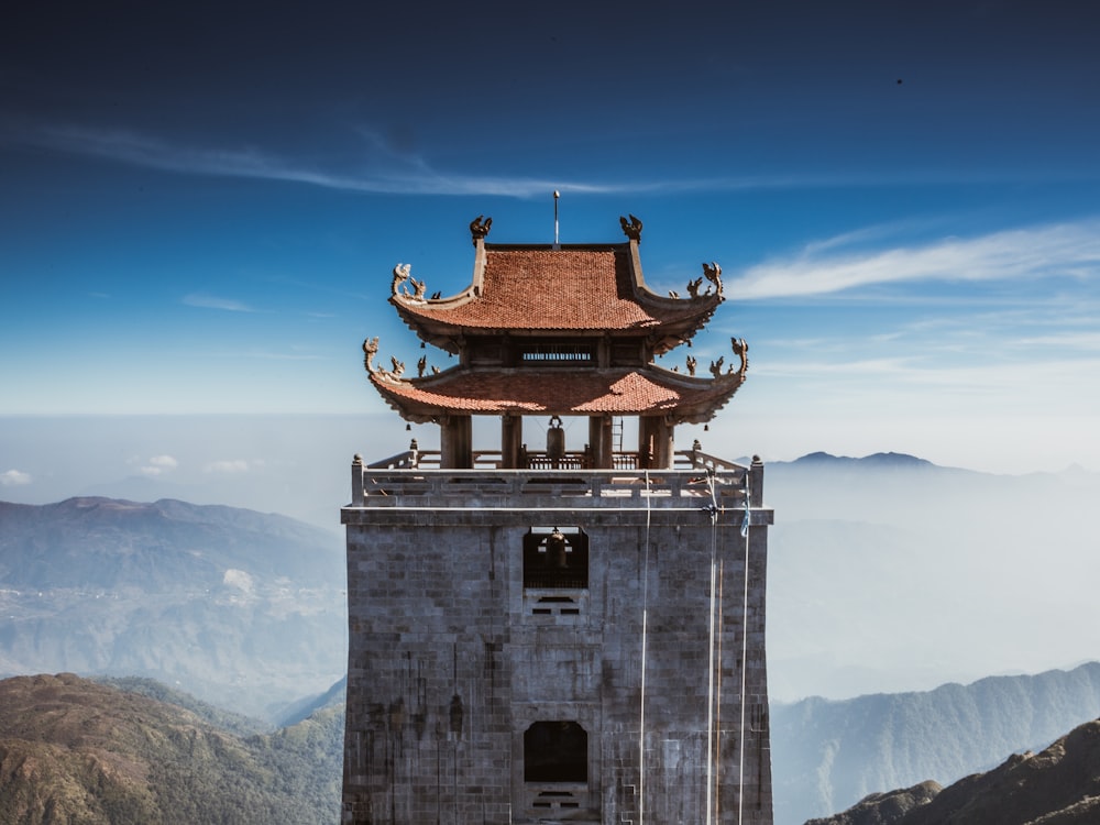 pagoda near mountain at daytime