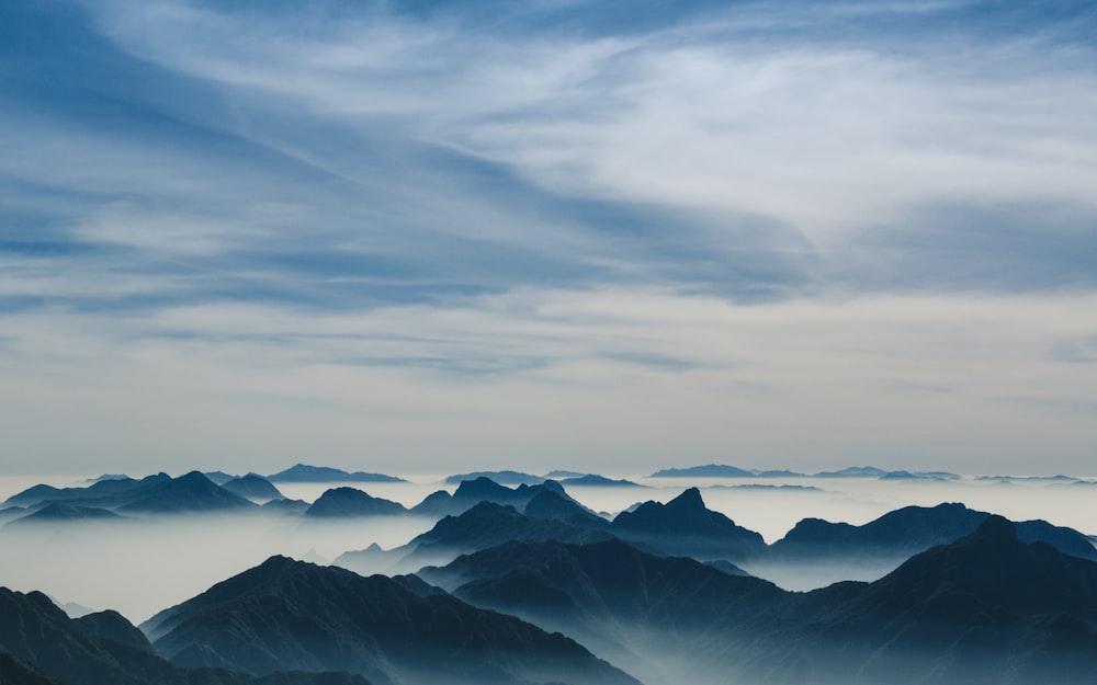 mountains under cloudy sky