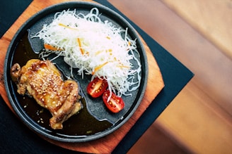 fired dish on black sizzling plate