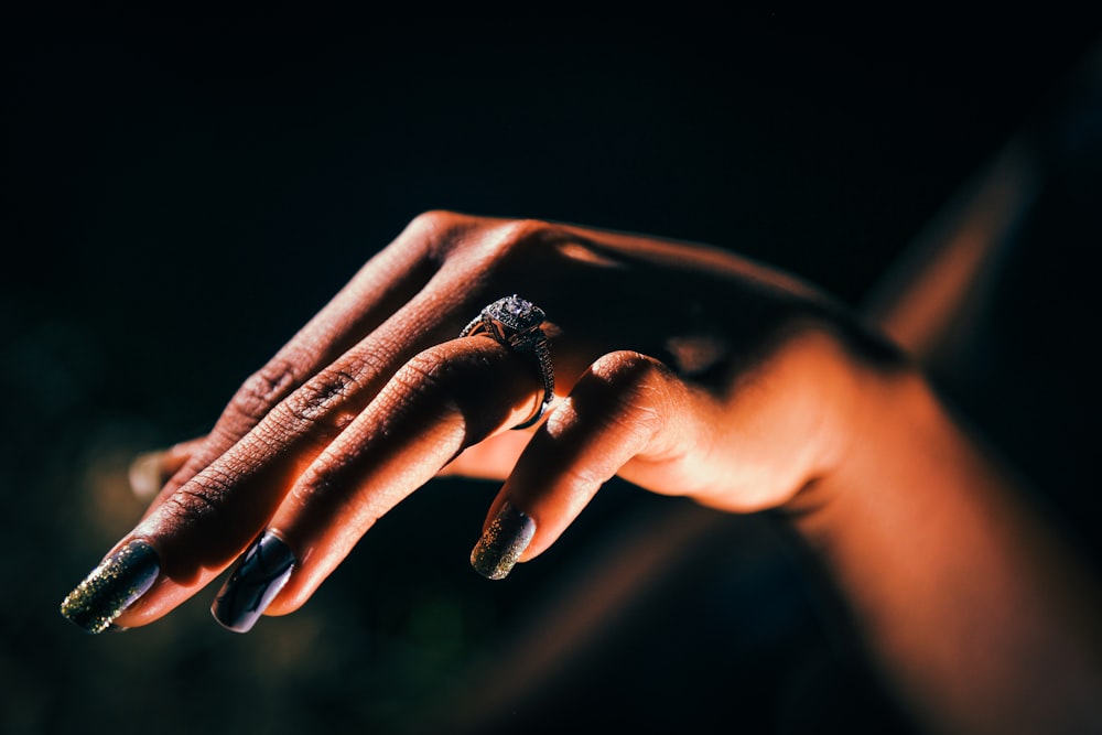 woman showing hand with ring