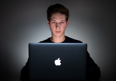 man using laptop carols zoom background