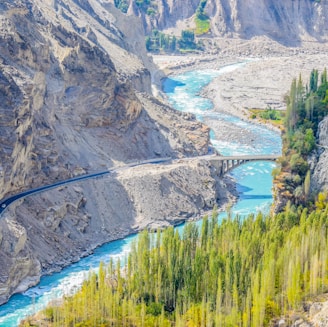 aerial photography of river surrounded by mountains