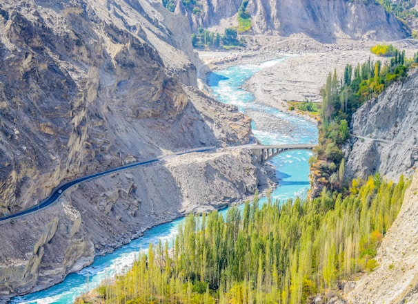 aerial photography of river surrounded by mountains