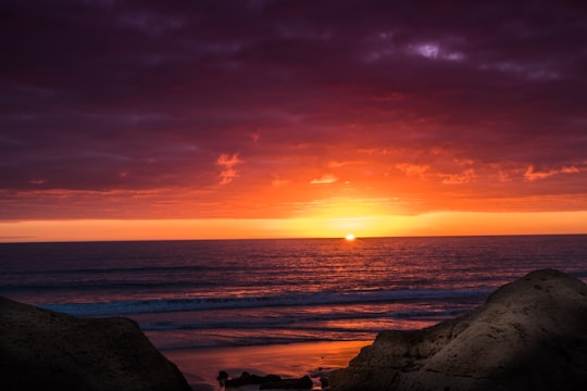 sunset over ocean in Faro Portugal