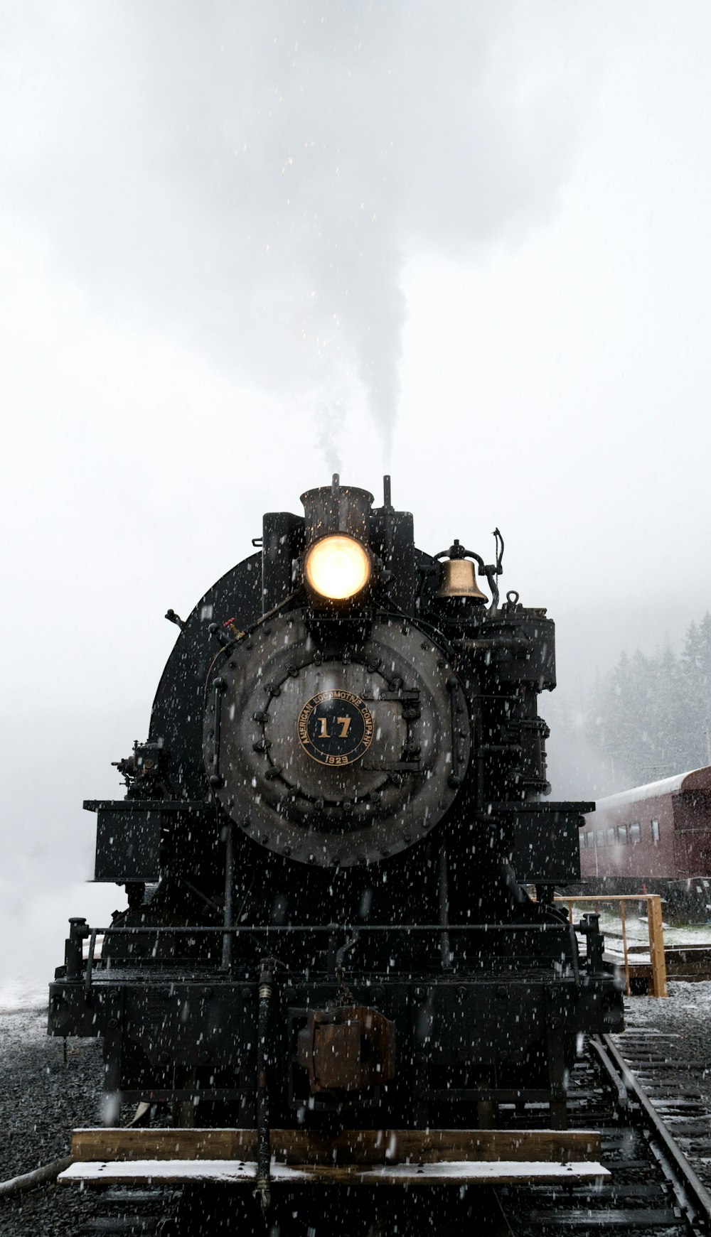 black train on railway at daytime