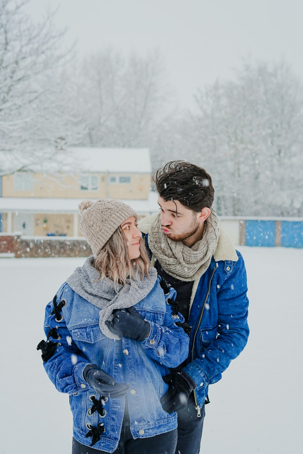 man and woman standing outside during winter