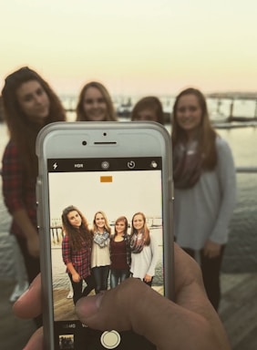 A warm, inviting photo of women collaborating on a boat deck in Chicago's harbor.