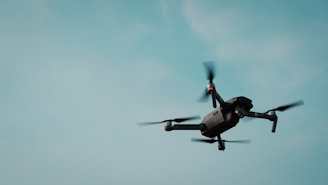 black and gray quadcopter drone