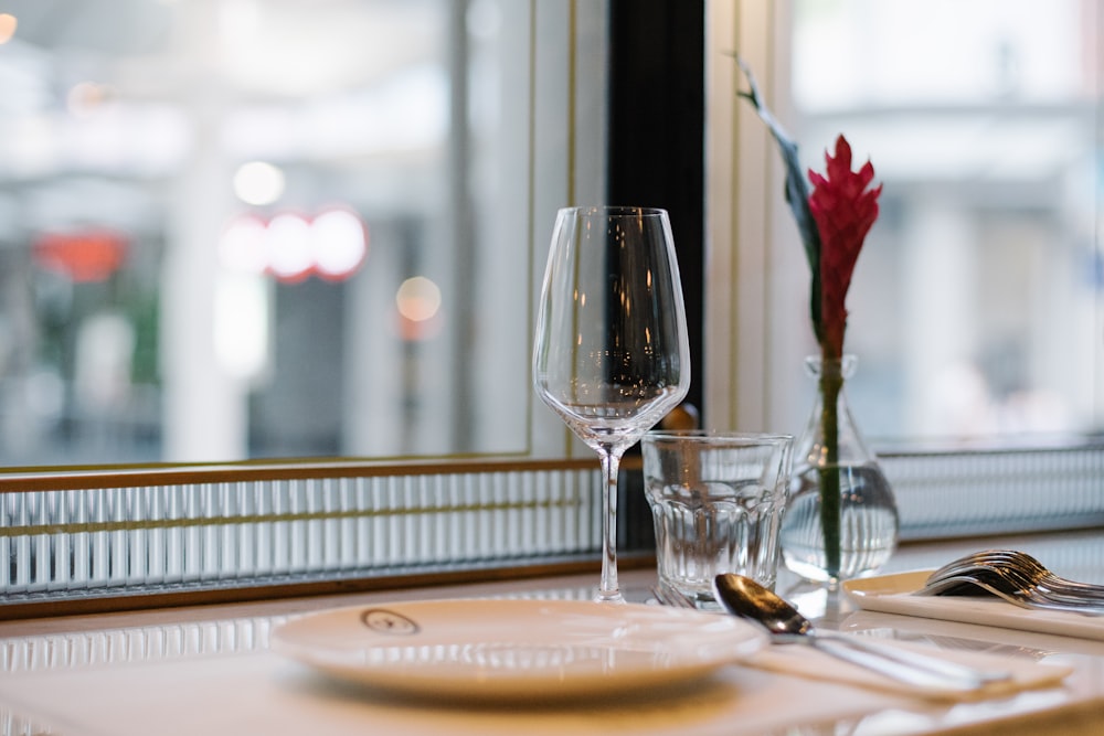 shallow focus photo of footed wine glass