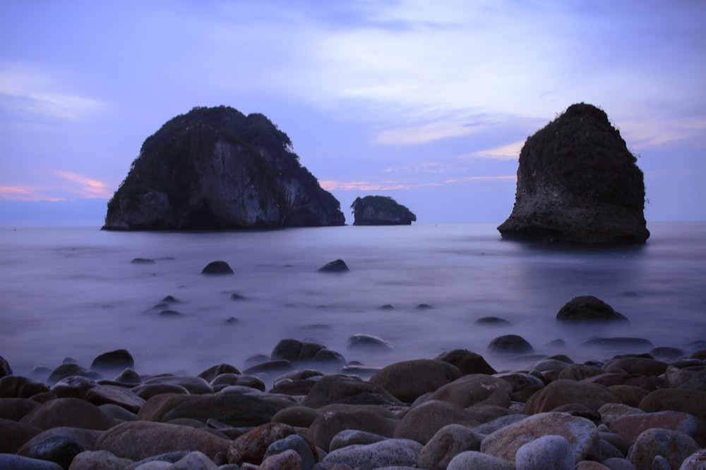 rock formations on body of water