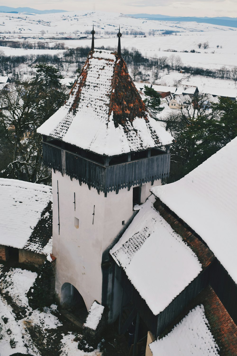 aerial photography of white and black concrete tower during winter
