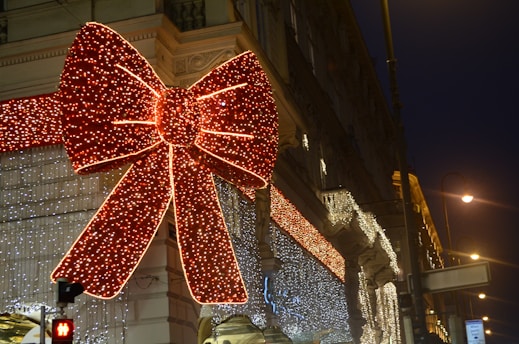 A commercial building adorned with bright, synchronized holiday lights creating a festive atmosphere.