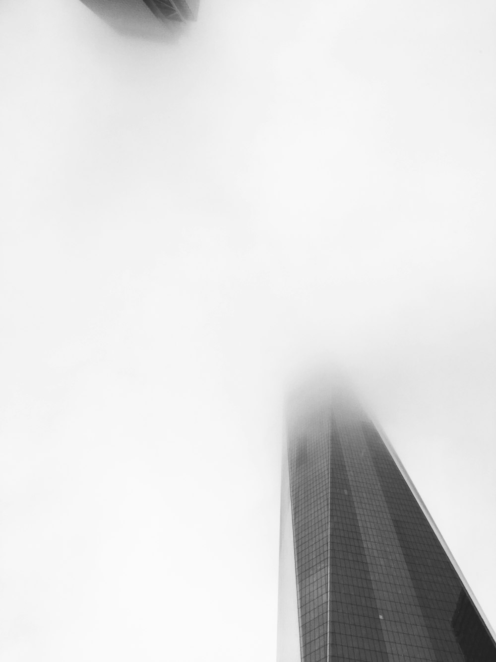 a black and white photo of a tall building