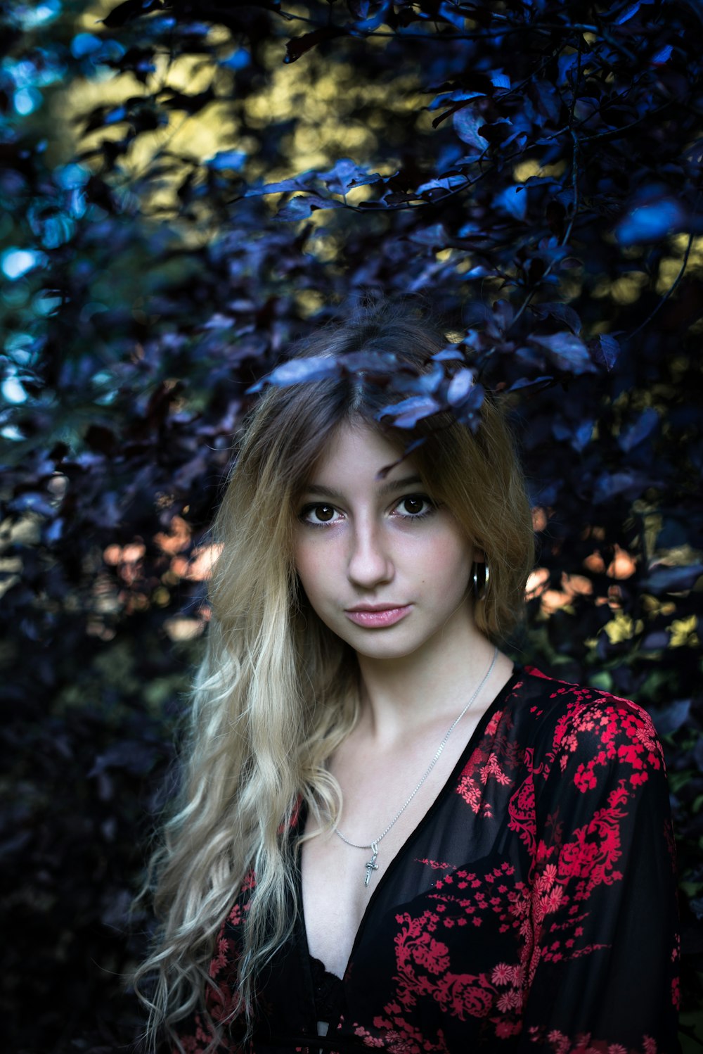 woman surrounded leaves in macro lens photography