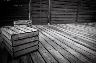 A wooden deck and fence freshly stained in rich, warm tones.