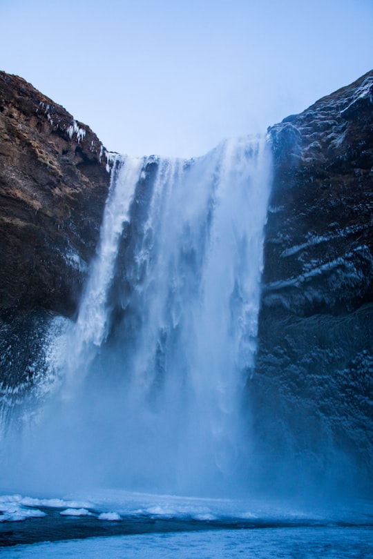 waterfall during daytime in Skógafoss Iceland