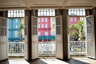 Bright room with large windows overlooking the charming streets of Balestrate.