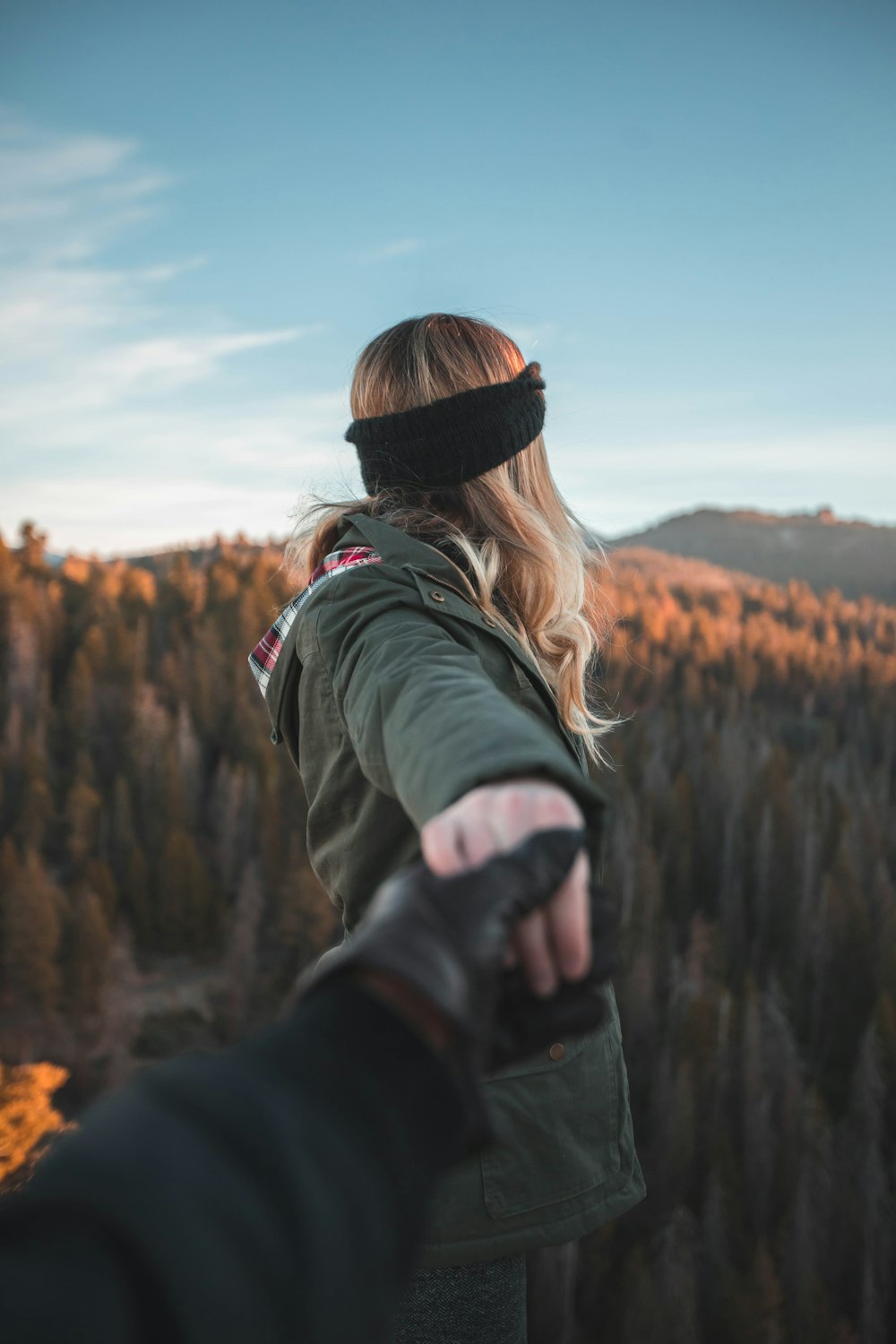 person holding hand of woman