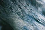 Close-up of detailed textures in an acrylic painting illustrating ocean currents and waves.