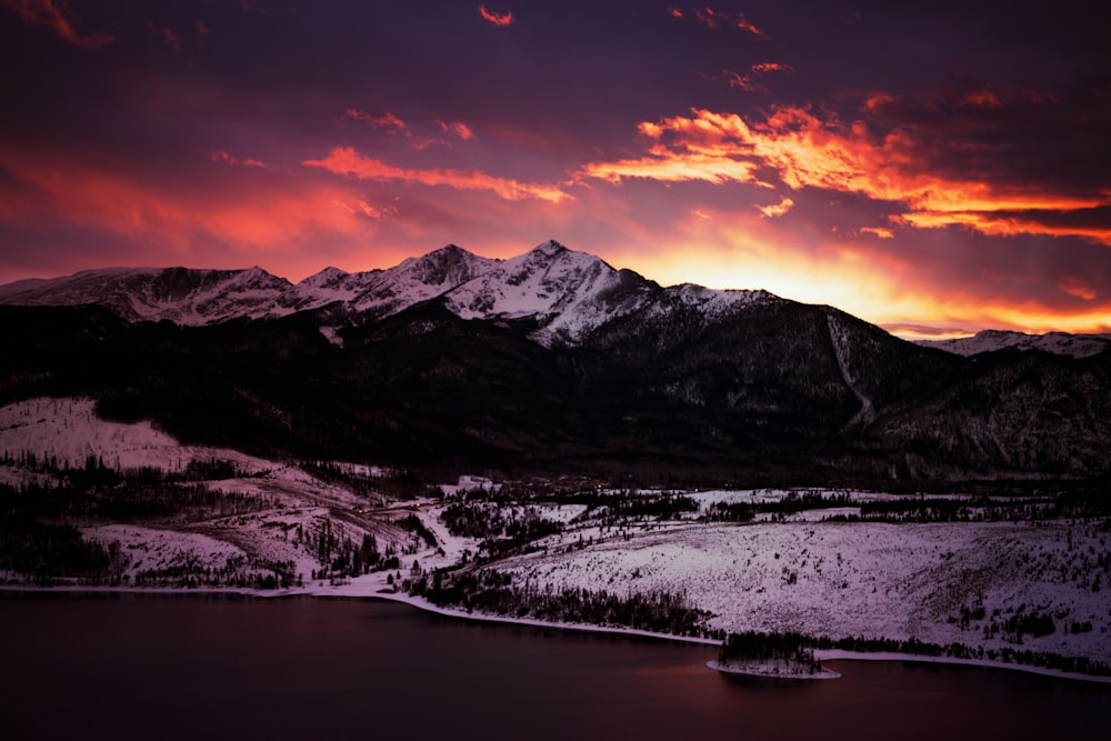 snow-covered mountain during golden hour