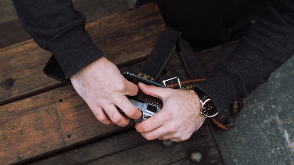 person holding film camera