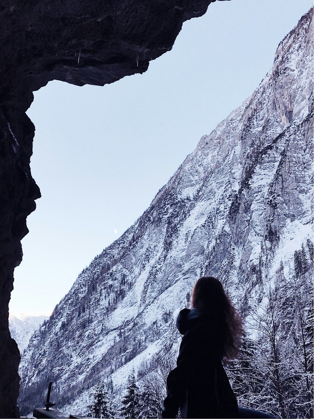 woman in black top standing near mountain
