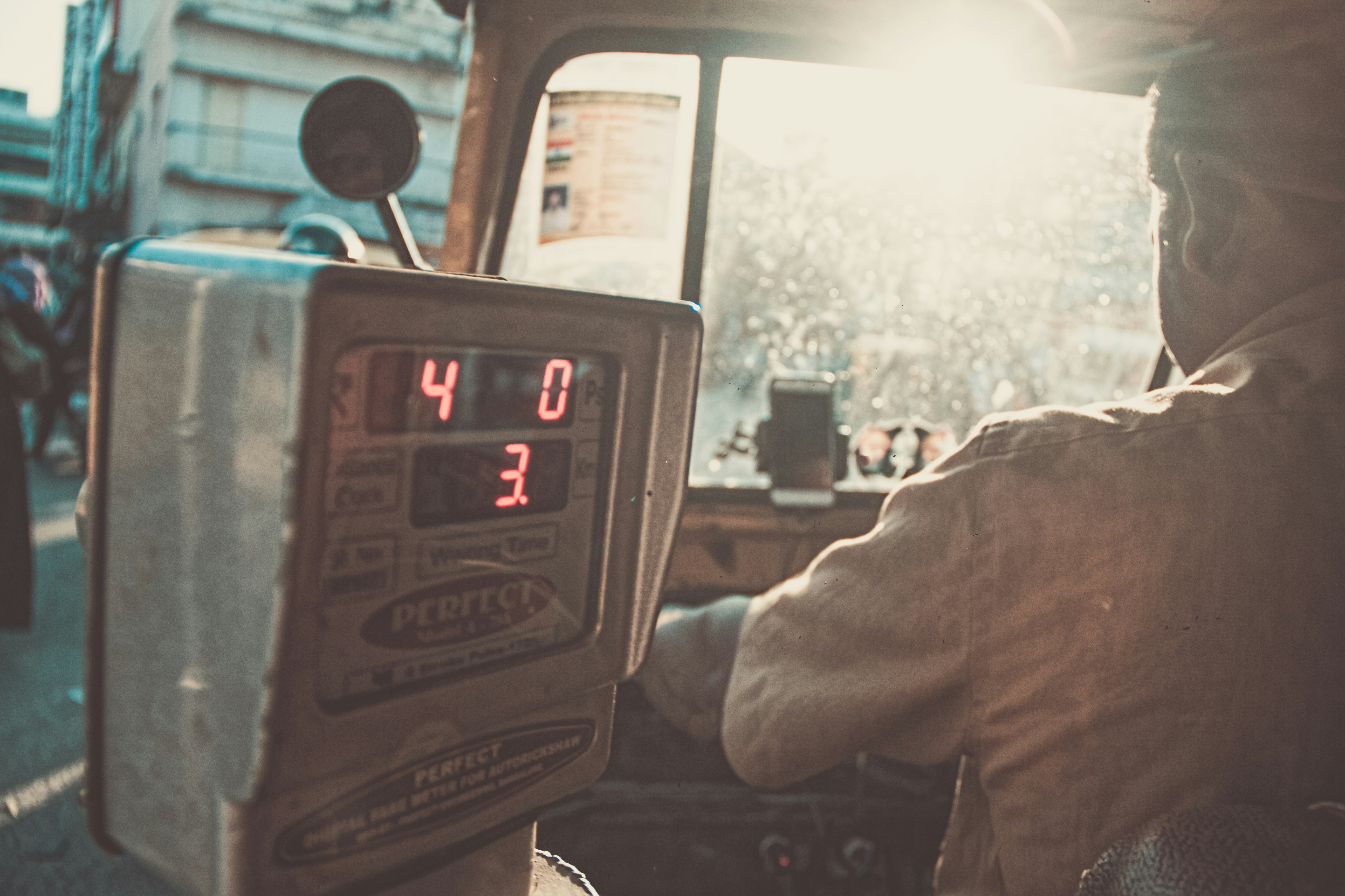 man riding in vehicle