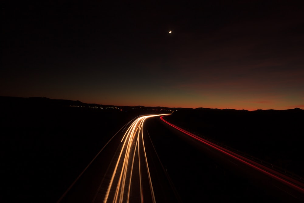 time lapse photography of highway at night