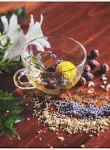 clear tea cup on brown surface