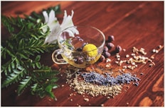 clear tea cup on brown surface