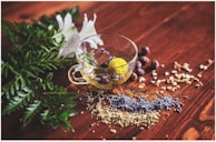 clear tea cup on brown surface