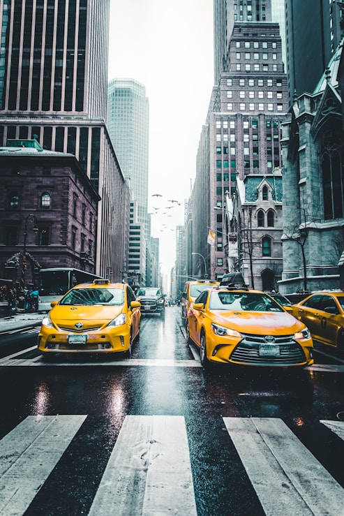 several car between of skycraper