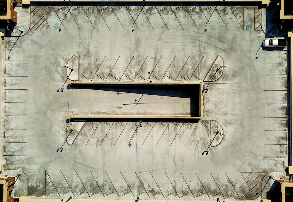 an aerial view of a parking lot with several empty benches