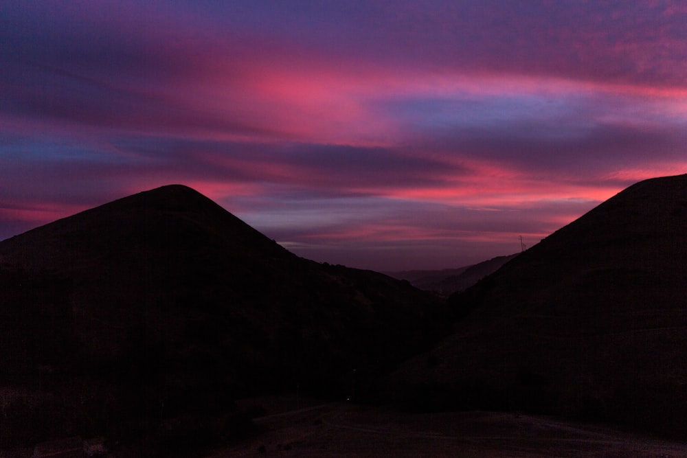 silhouette of mountains during sunset