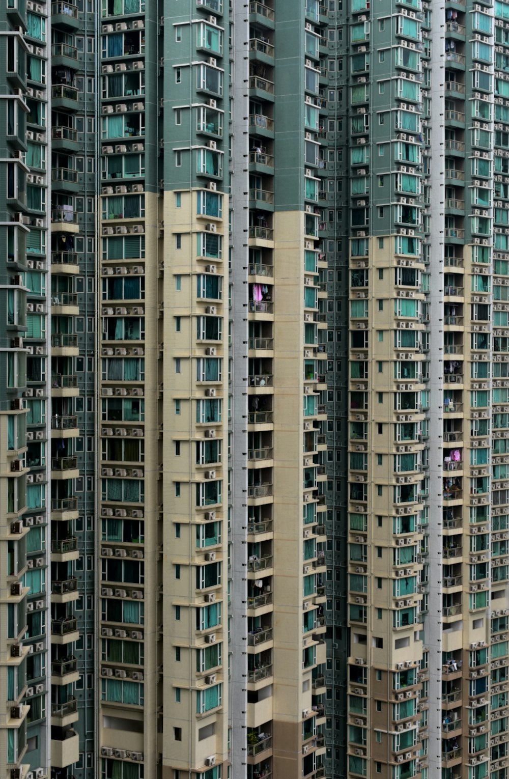 white and gray wall paint high-rise building during daytime