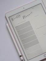 A clean, colorful budget planner template displayed on a tablet.